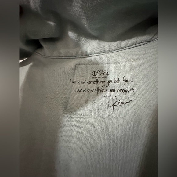 Peace Love World sweater is a size Medium. - Picture 6 of 7